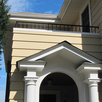 Portico with pediment and arch