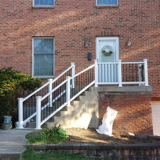 Mid-sized transitional front porch photo in Other