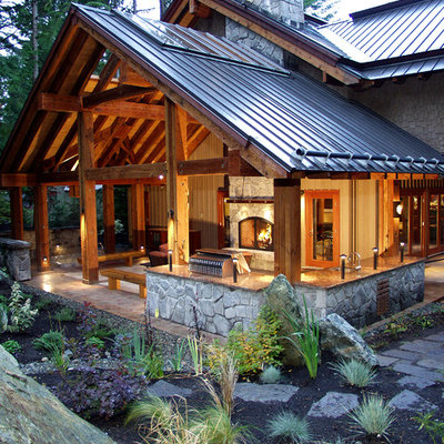 This is an example of a traditional porch design in Vancouver with a roof extension.