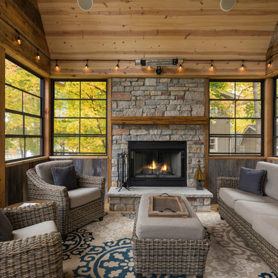 Inspiration for a cottage screened-in porch remodel in Minneapolis with a roof extension