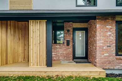 This is an example of a contemporary porch design in Calgary.