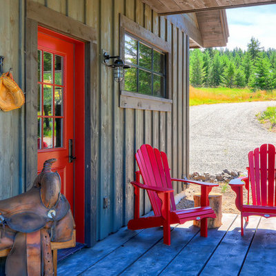 Inspiration for a rustic front porch remodel in Seattle with decking and a roof extension