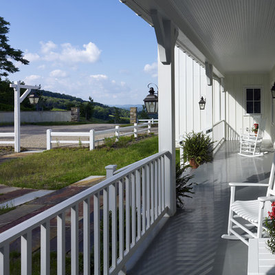Cottage porch idea in DC Metro with decking and a roof extension