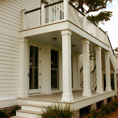 Classic porch idea in Other with a roof extension