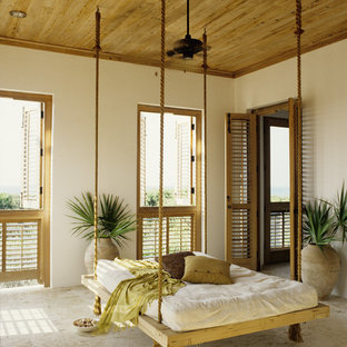 This is an example of a large tropical tile screened-in back porch design in Miami.