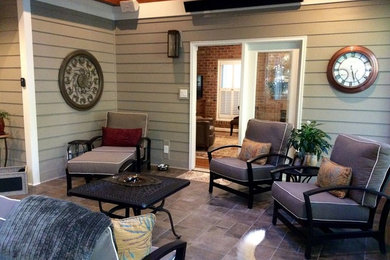 Mid-sized transitional tile screened-in back porch photo in Raleigh with a roof extension