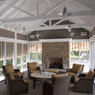 Inspiration for a mid-sized contemporary screened-in side porch remodel in Chicago with a roof extension and decking
