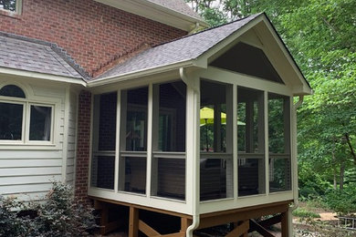 Small minimalist screened-in side porch photo in Raleigh