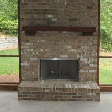 Screen Porch Fireplace with Floating Cedar Mantle