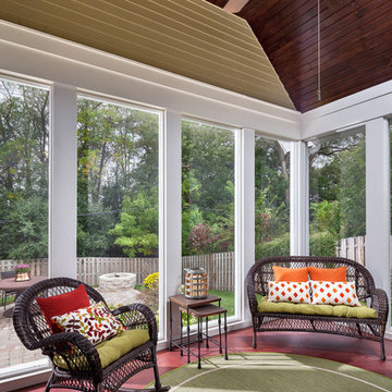 Screen porch with v-groove pine wood ceiling and stained concrete floor