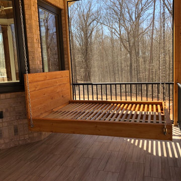 Screened in back porch with bed swing