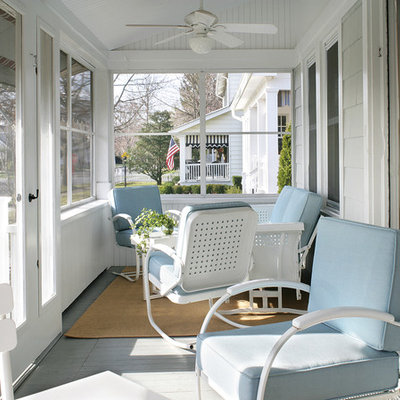 Mid-sized beach style screened-in front porch idea in Newark with decking and a roof extension