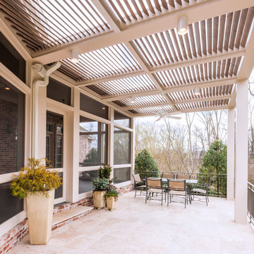 Screened porch addition & arbor with slanted louvers in Nashville's Belle Meade