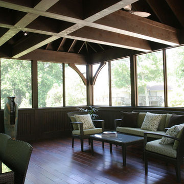 Screened Porch with Exposed Beams and Hardwood Floors
