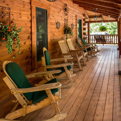 Inspiration for a large rustic front porch remodel in DC Metro with decking and a roof extension
