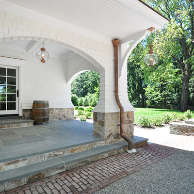 Inspiration for a timeless porch remodel in New York with a roof extension