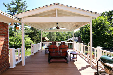 Mid-sized elegant back porch photo in Louisville with decking and a roof extension