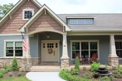 This is an example of a mid-sized stamped concrete front porch design in St Louis.