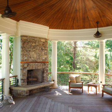 Stacked stone outdoor fireplace centers circular porch