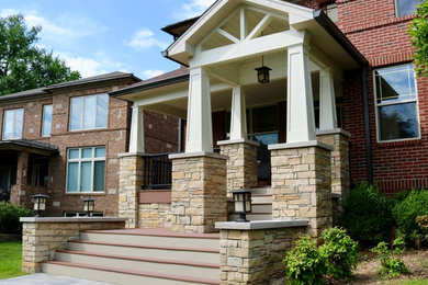 Inspiration for a small timeless front porch remodel in Louisville with a roof extension