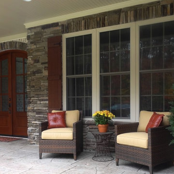 Stone, brick and cedar on front porch