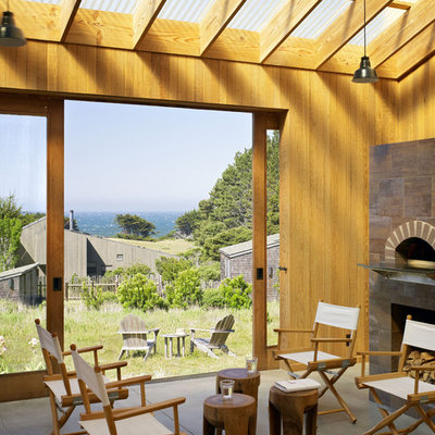 Farmhouse porch idea in San Francisco with a fire pit and a roof extension