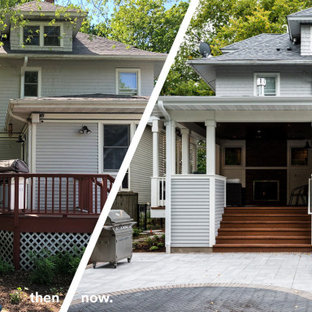 Esempio di un grande portico american style dietro casa con un caminetto, pavimentazioni in cemento e un tetto a sbalzo