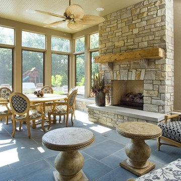 Sun Room with Bluestone Flooring, Bead Board Ceiling, and Stone Fireplace