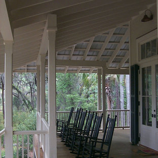This is an example of a coastal porch design in Atlanta.