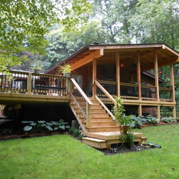 Timber framed porch added to home on wooded lot in Monrovia, MD