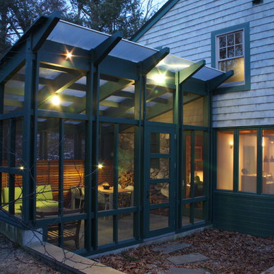 This is an example of a traditional porch design in Boston with a roof extension.