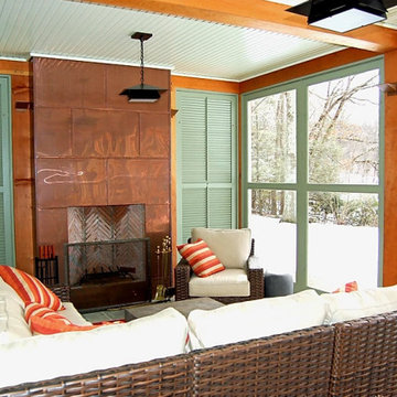 Timberframe screen porch with copper breasted fireplace