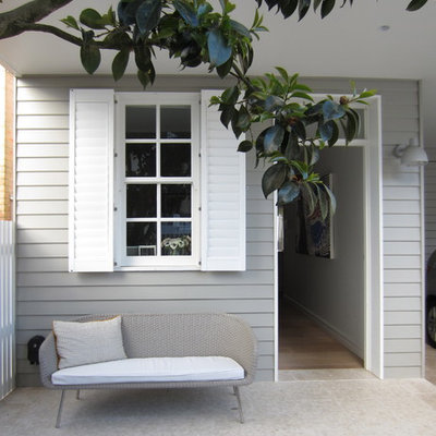 Elegant porch photo in Sydney with a roof extension