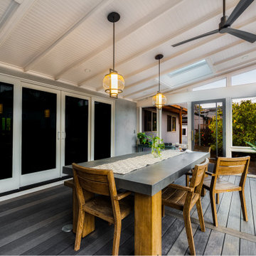 Walk Out Screened-In Porch With Grey Decking and White Roofing