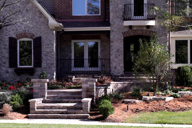 Inspiration for a mid-sized brick front porch remodel in Chicago
