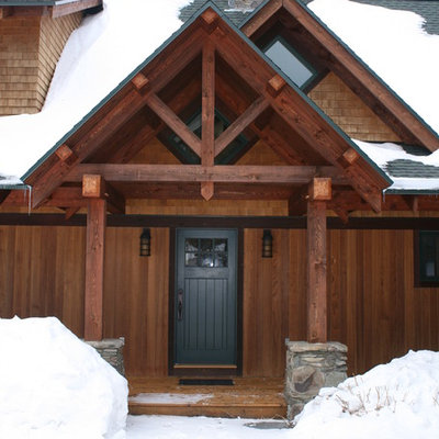 Mid-sized mountain style front porch photo in Burlington with decking and a roof extension