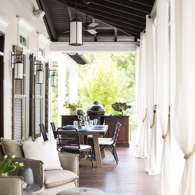 Inspiration for a coastal side porch remodel in Raleigh with decking and a roof extension