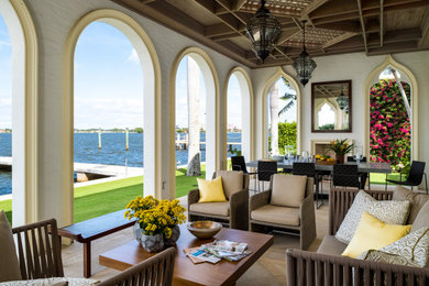 This is an example of a mediterranean porch design in Miami.