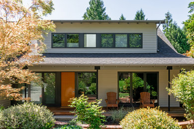 Inspiration for a medium sized farmhouse front veranda in Seattle with a roof extension.