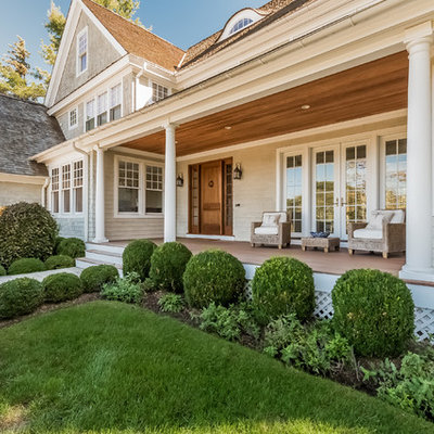 Mid-sized beach style porch idea in New York with decking and a roof extension