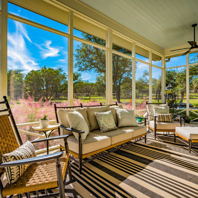 Farmhouse screened-in porch photo in Austin with a roof extension