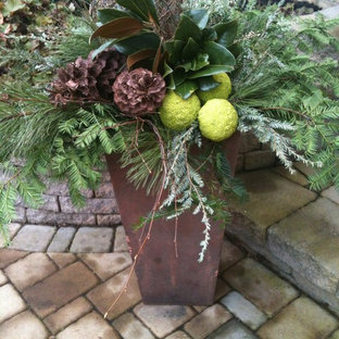 Immagine di un piccolo portico boho chic davanti casa con un giardino in vaso