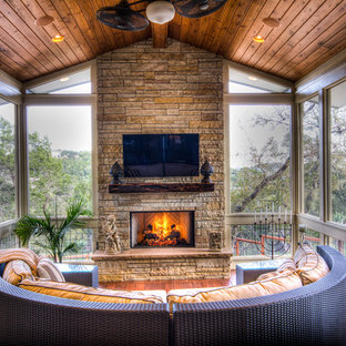 Large eclectic screened-in back porch photo in Austin with decking