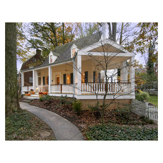 one story house with wrap around porch