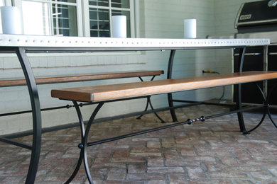 Zinc riveted table top Wrought iron benches