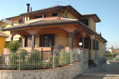 This is an example of a medium sized contemporary front screened veranda in Florence with brick paving and a pergola.