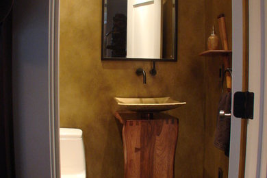 Small ceramic tile and gray floor powder room photo in DC Metro with a one-piece toilet, beige walls and a vessel sink