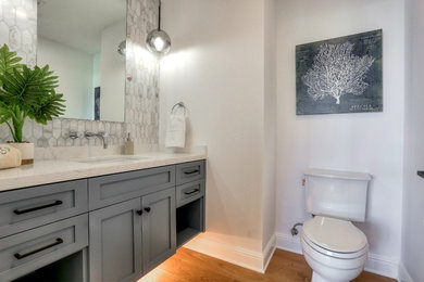 Example of a transitional powder room design in Los Angeles