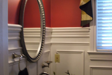 Example of a transitional powder room design in Providence