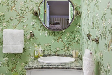 Inspiration for a timeless powder room remodel in Detroit with a one-piece toilet, green walls and a console sink